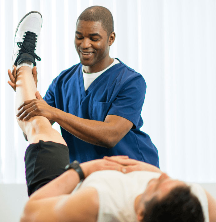 a man getting a foot massage from a professional massager.